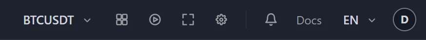 The right half of the toolbar: the saved layout named BTCUSDT, the grid, replay, fullscreen and settings icons, the bell, Docs, the language menu and the round account button.